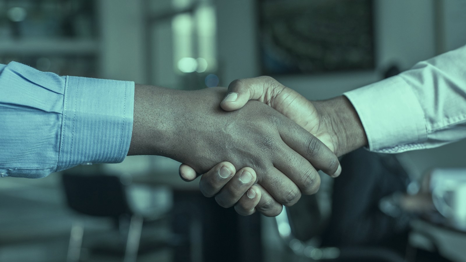 AI executive hiring cover, two professionals shaking hands after agreeing terms, Axial Search