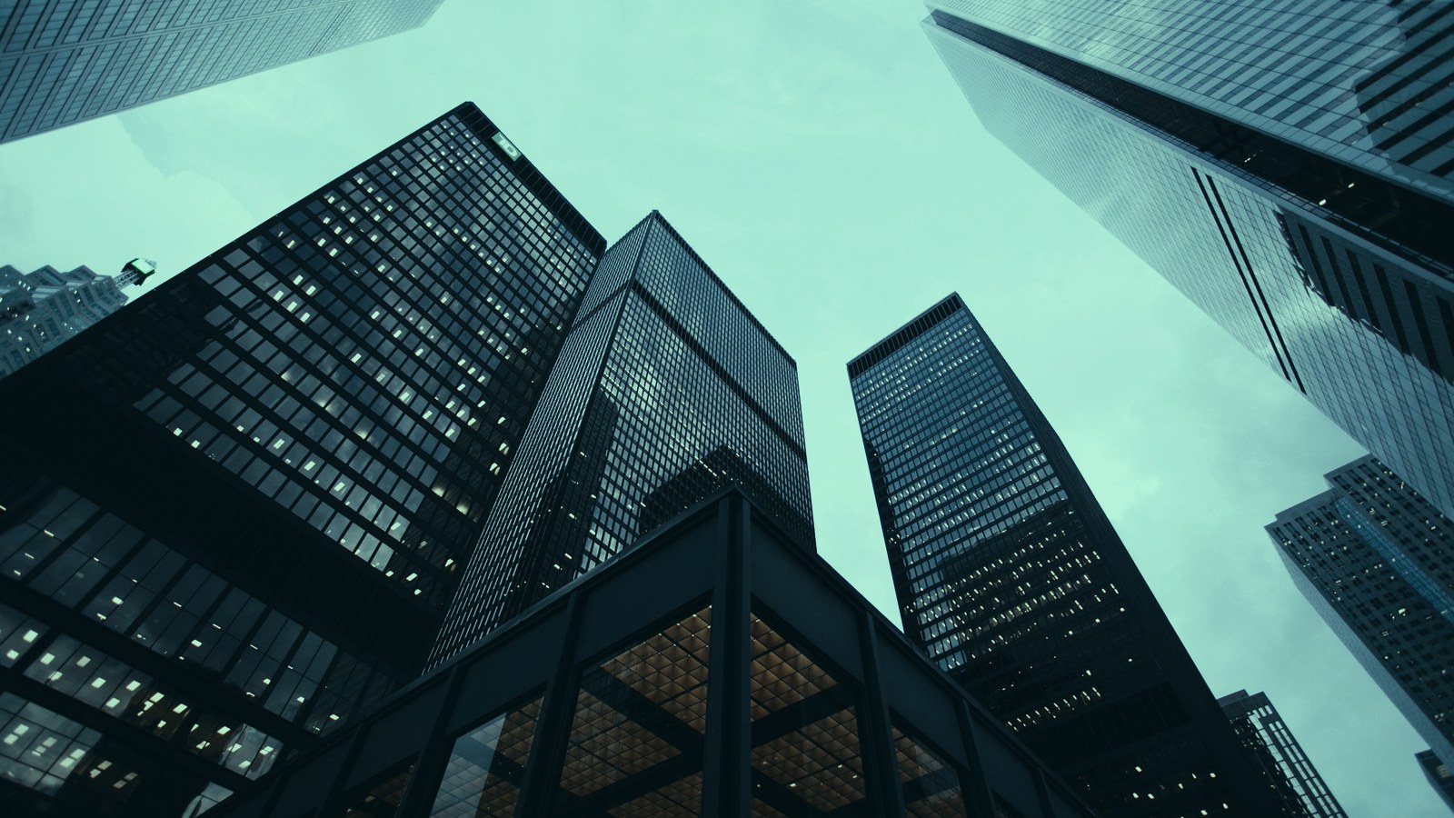 AI executive search firm cover, corporate towers seen from street level, Axial Search