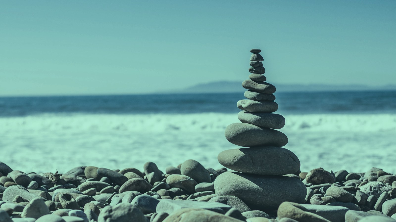 AI leader salary range cover, balanced stones stacked in uneven tiers on a shore, Axial Search