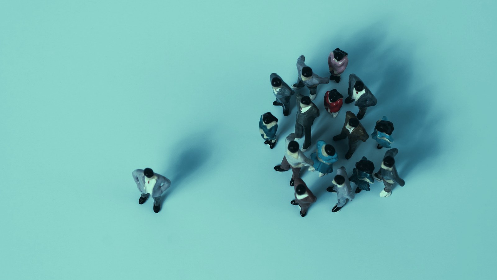 AI leadership reporting structure cover, a lone figure standing apart from a cluster of colleagues seen from above, Axial Search