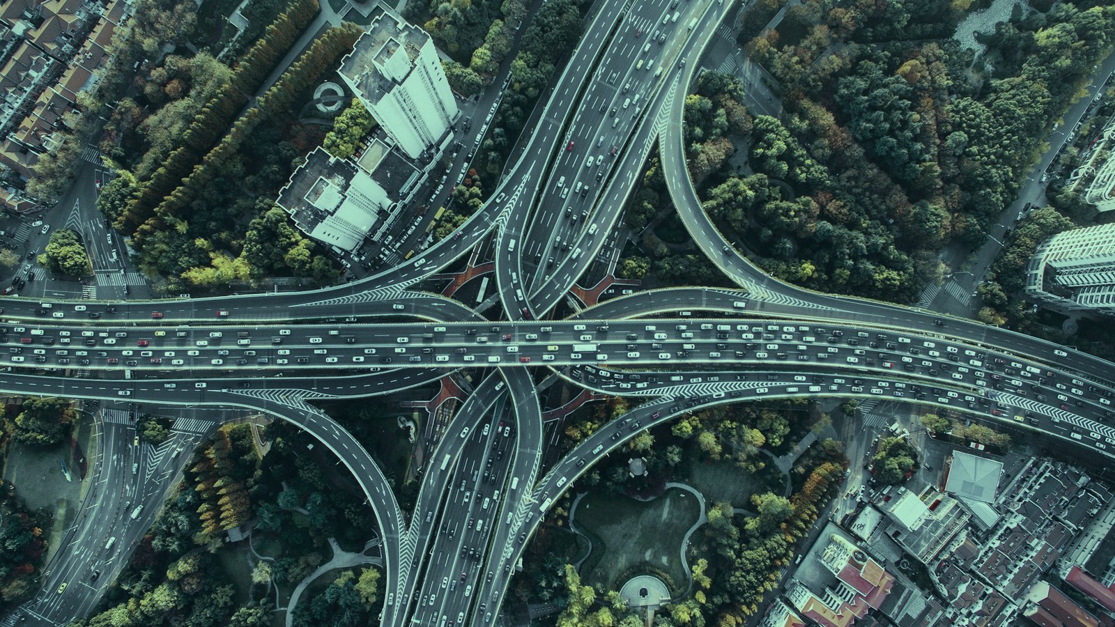 AI transformation roles cover, a multi level road interchange seen from above, Axial Search