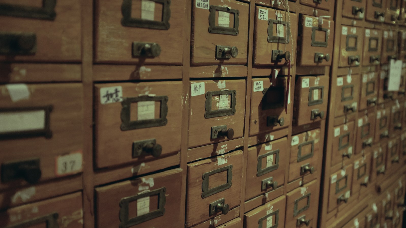 What is executive search: a wall of wooden card-catalog drawers
