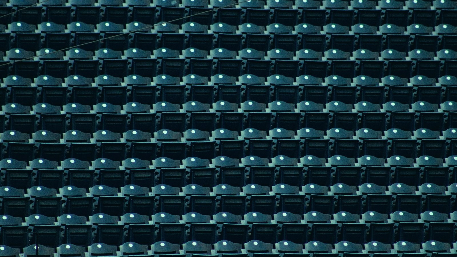 Dedicated AI leader cover, rows of empty seats awaiting an occupant, Axial Search