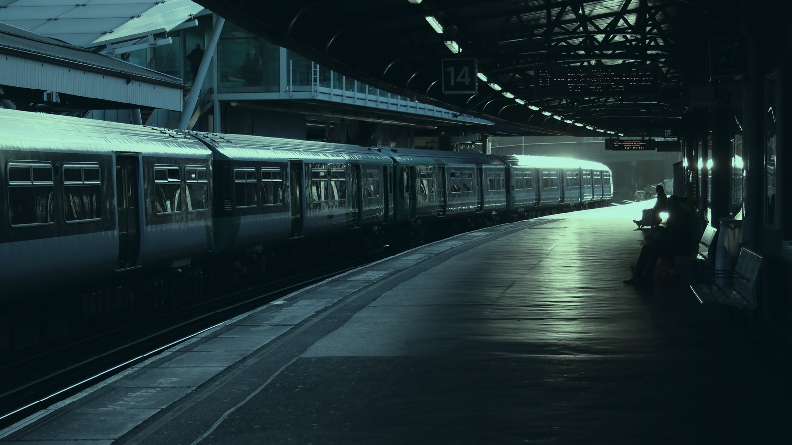 Senior AI executive search cover, a station platform lit by late afternoon sun, Axial Search